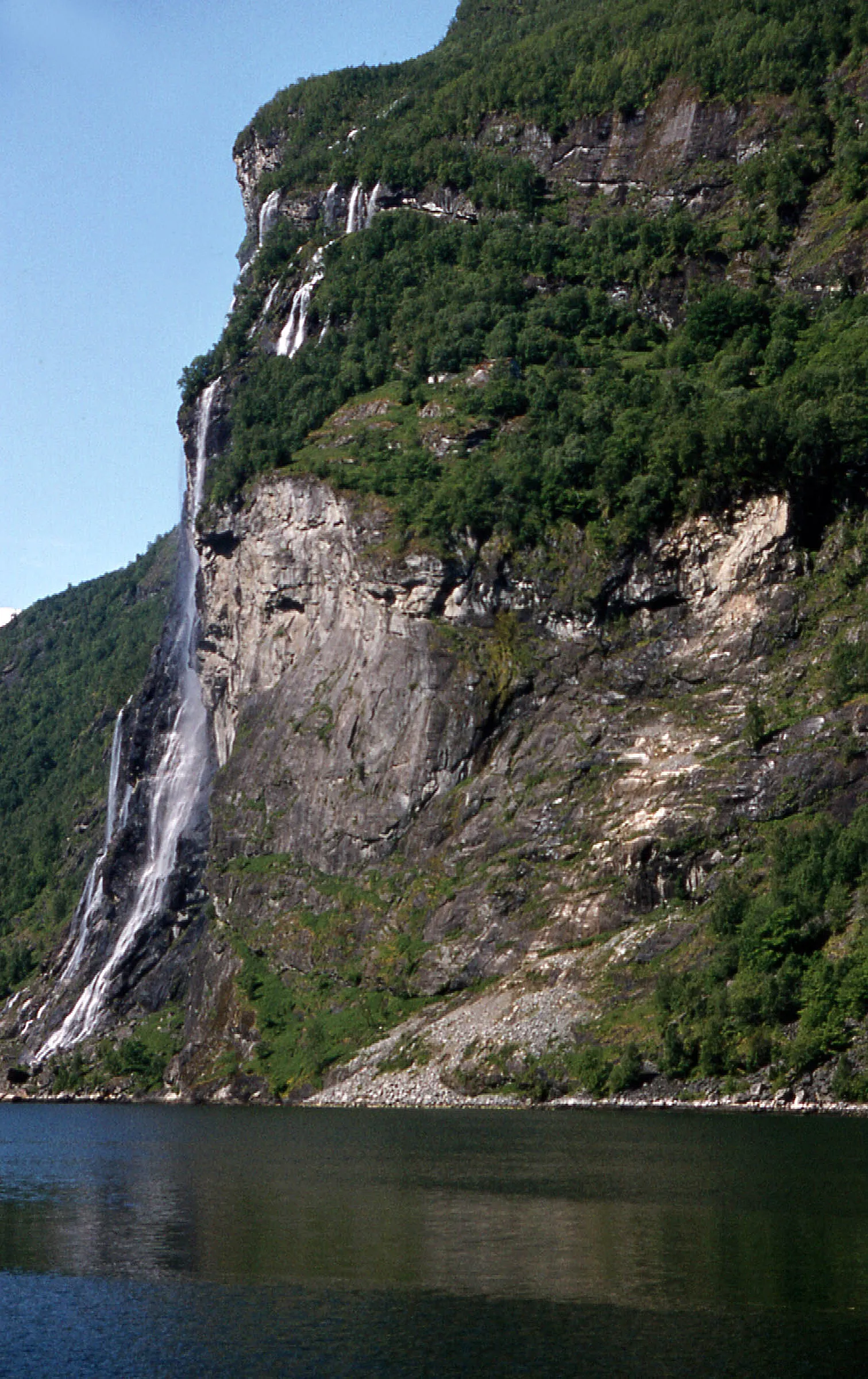 The Seven Sisters waterfall dropping into the Geirangerfjord, seen from a sightseeing boat.